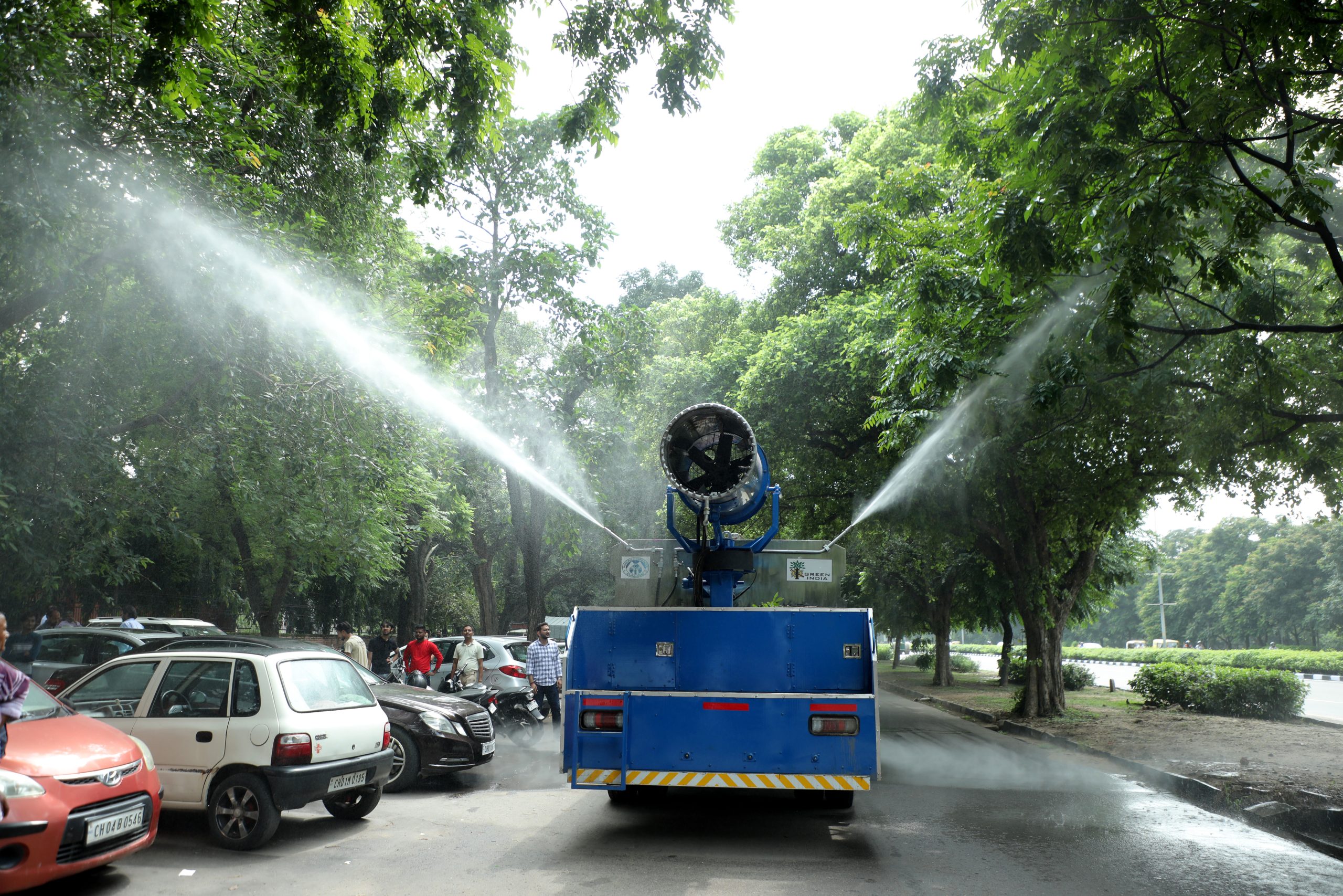 Water sprinkler vehicles to combat air and dust pollution in city